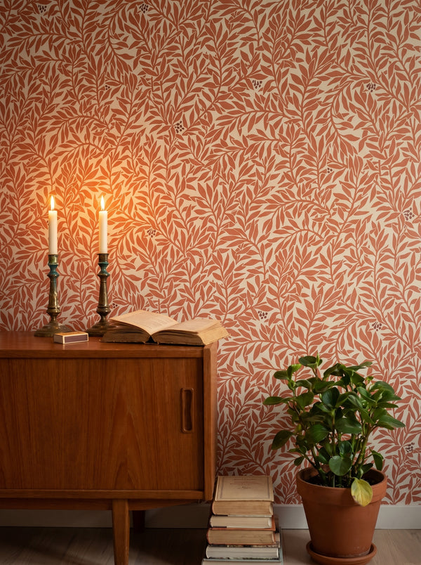 Serpentin Warm Terracotta wallpaper in a styled interior