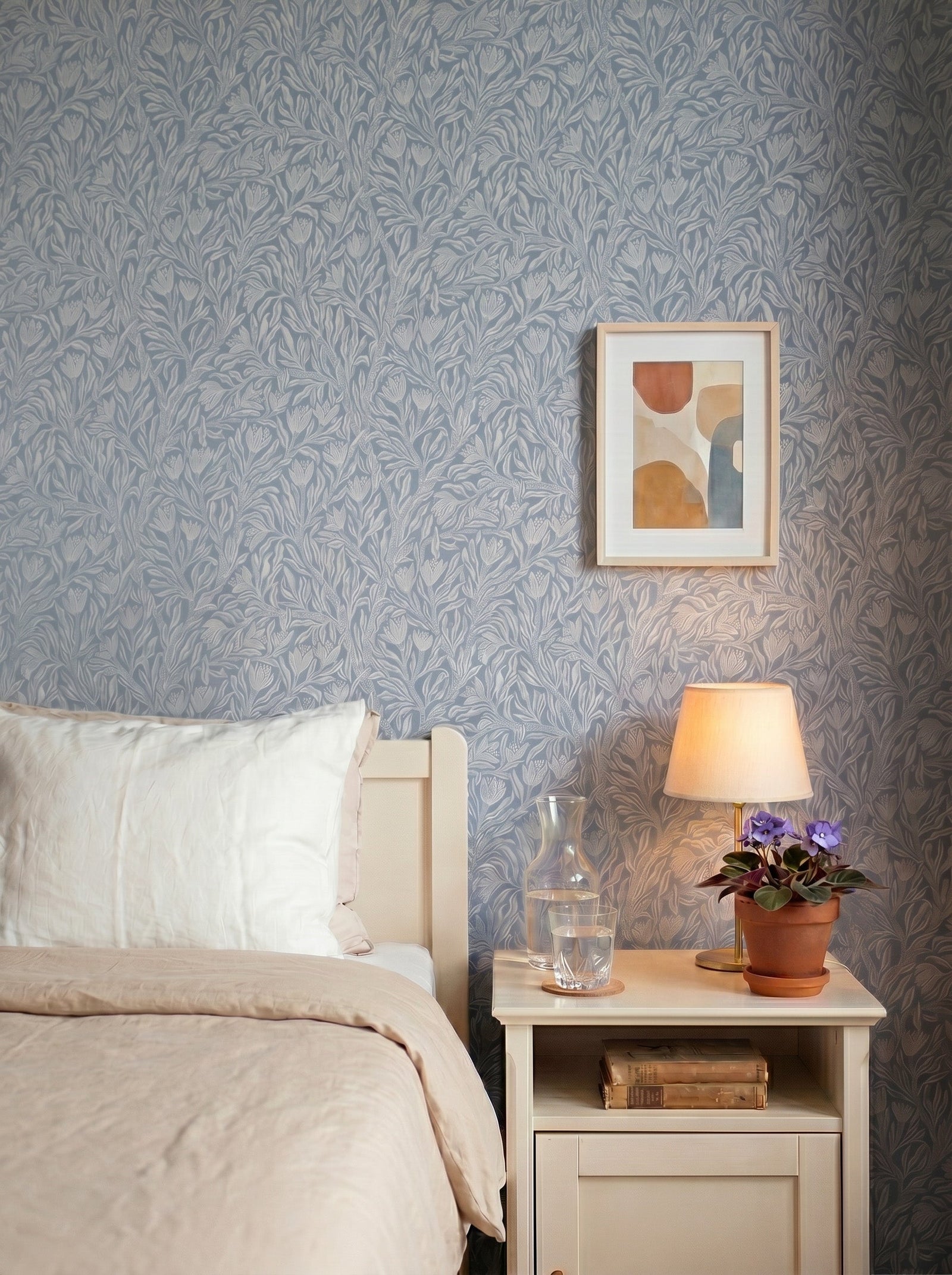 Krokus Smokey Blue wallpaper decorating an interior wall