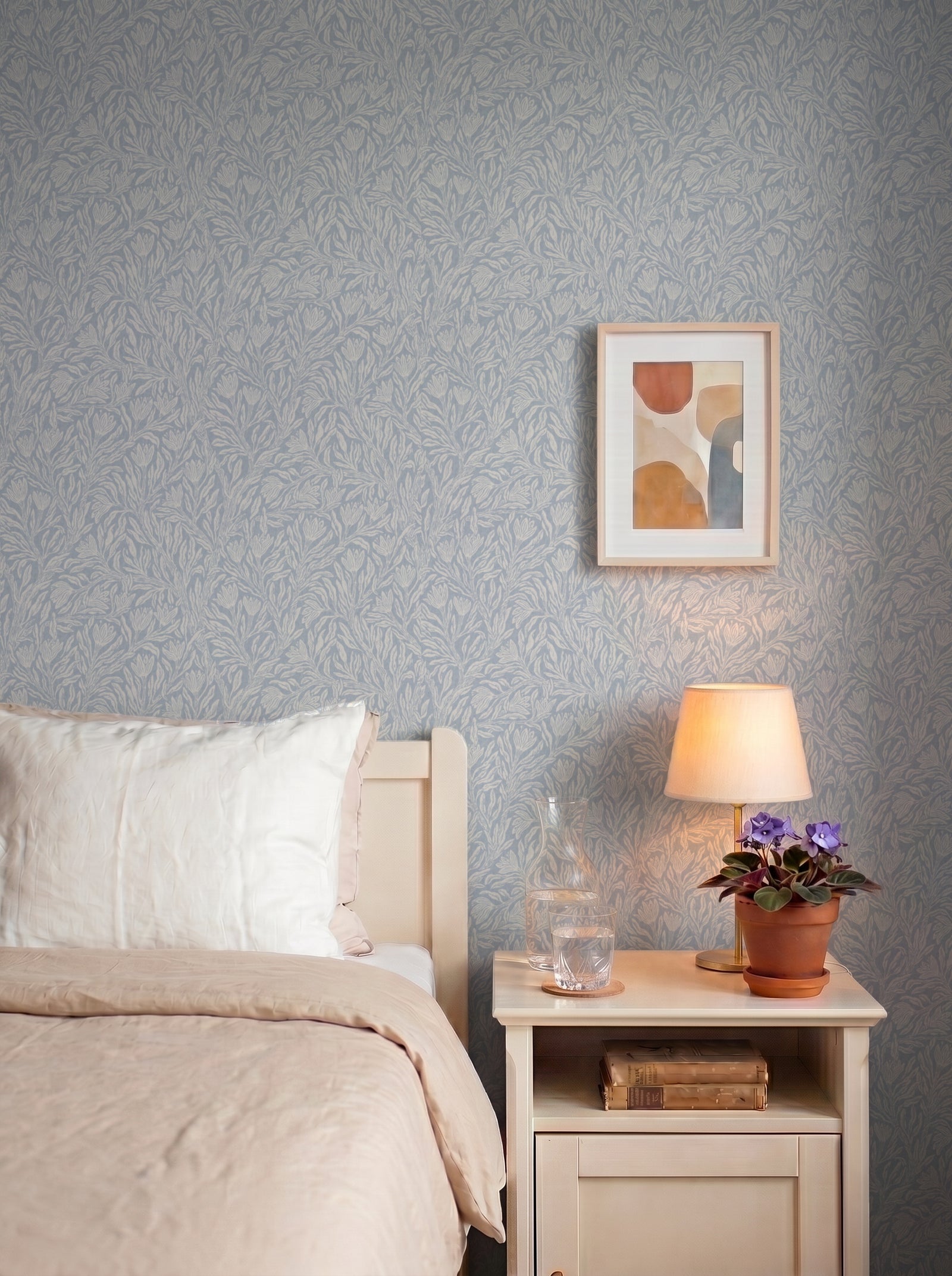 Krokus Smokey Blue wallpaper decorating an interior wall