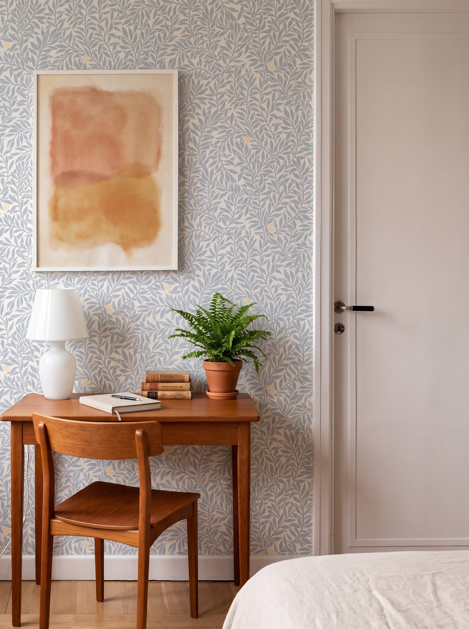 Serpentin Sunny Blue wallpaper in a styled interior