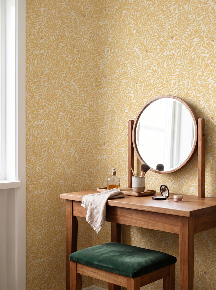 Serpentin Sunny Ochre wallpaper styled in an interior setting