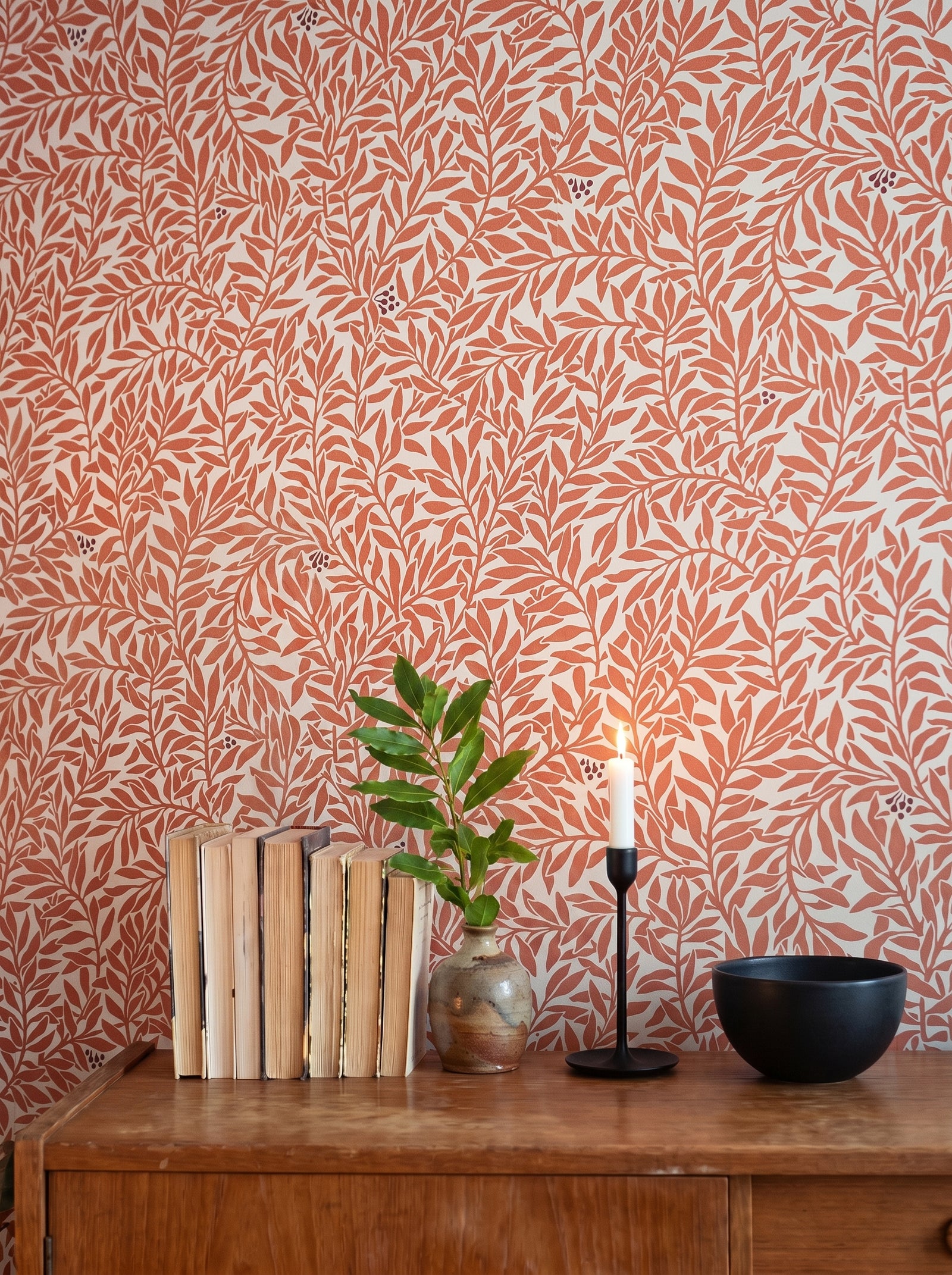 Serpentin Warm Terracotta wallpaper decorating an interior wall