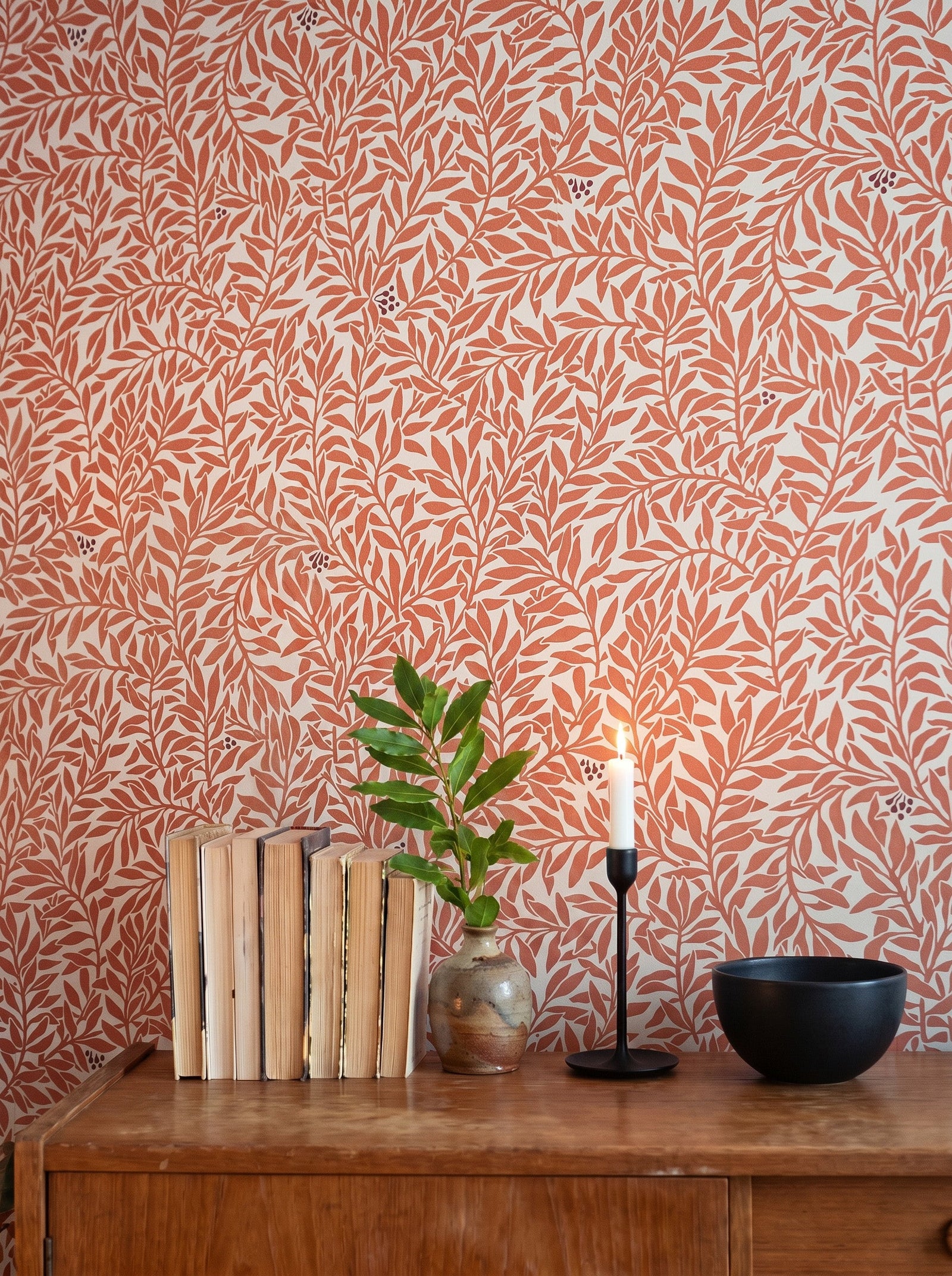 Serpentin Warm Terracotta wallpaper decorating an interior wall